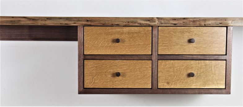 Detail of floating walnut drawer section