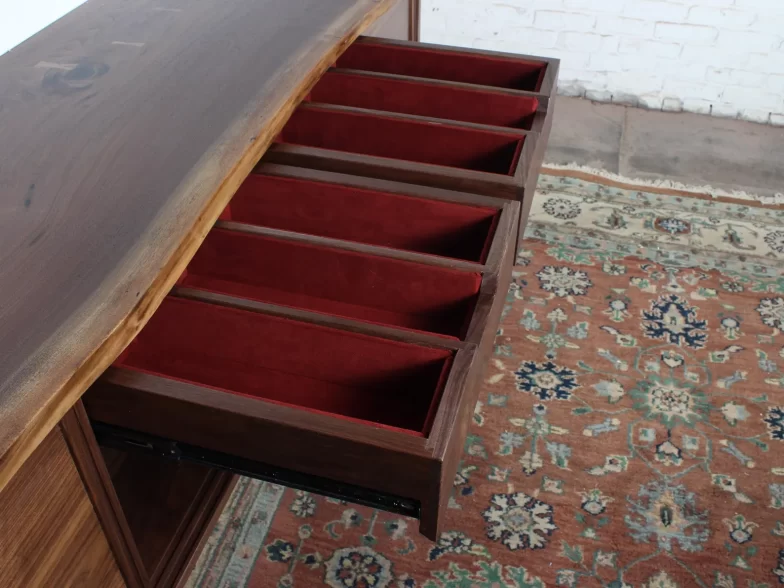 Upholstered drawers to hold flat and silverware