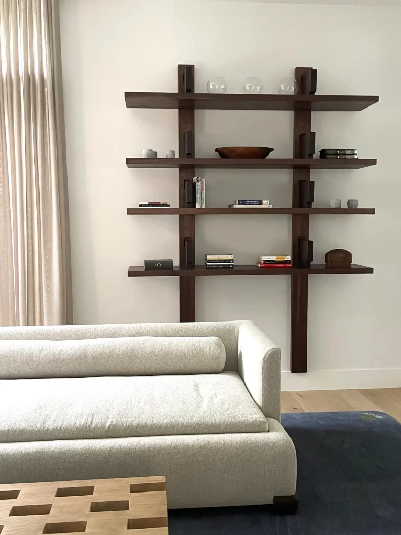 Custom 6 foot wide walnut Pierre Chapo bibliotheque style wall mounted bookcase shelves